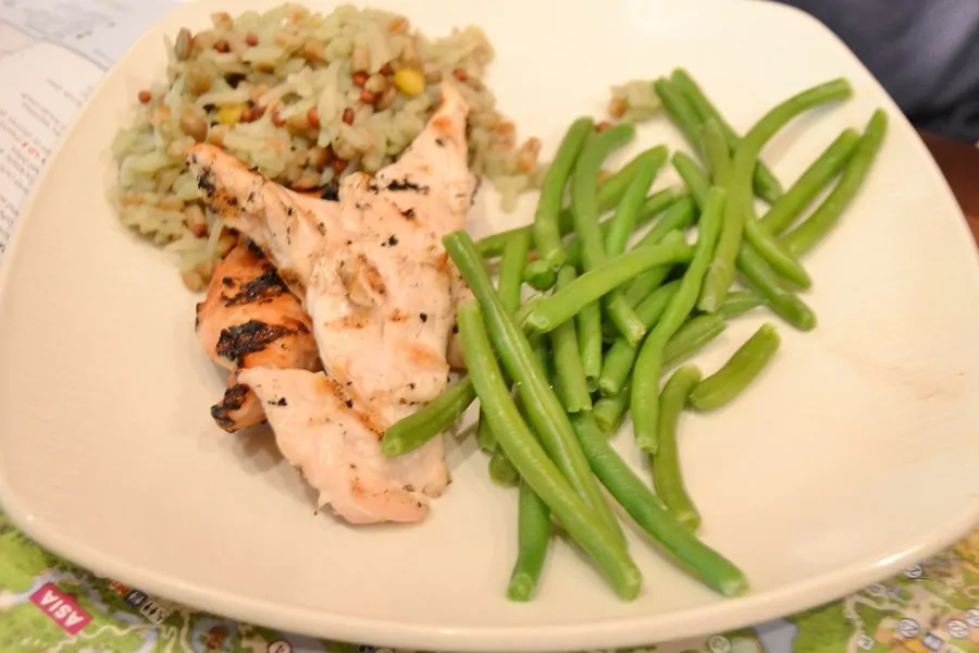 Pan-seared Sustainable Fish with Seasonal Vegetables, Multigrain Rice, and fresh Fruit Salad