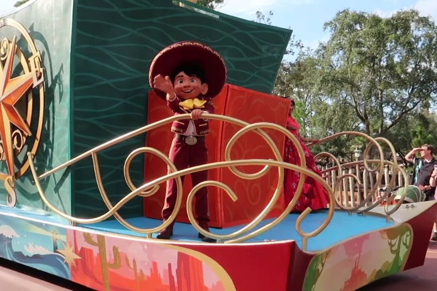 Coco Characters at Disney World: Miguel is on the float in the Adventure Friends Calvacade